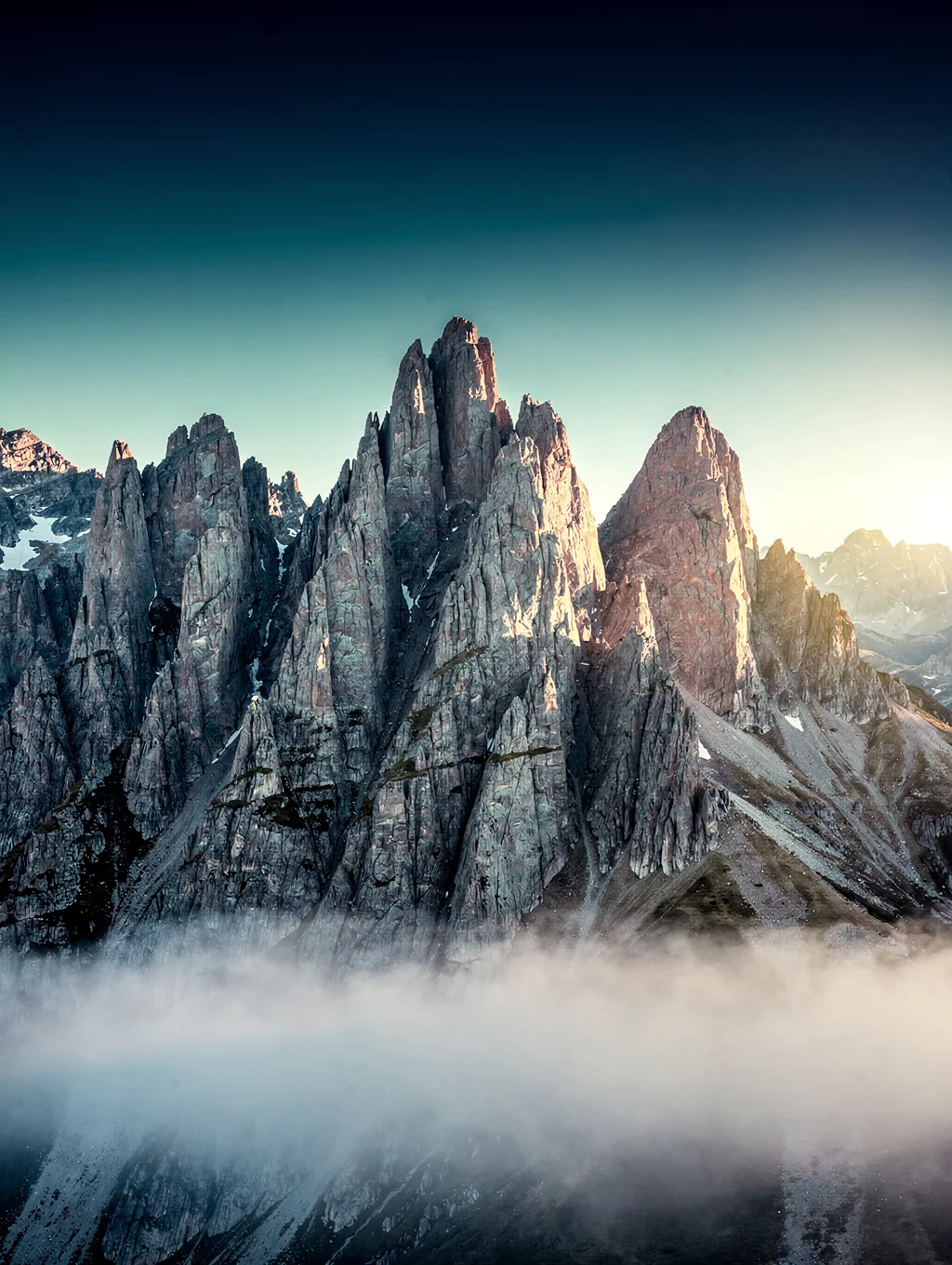 Distant mountain ridge in Patagonia bathed in violet sunset light